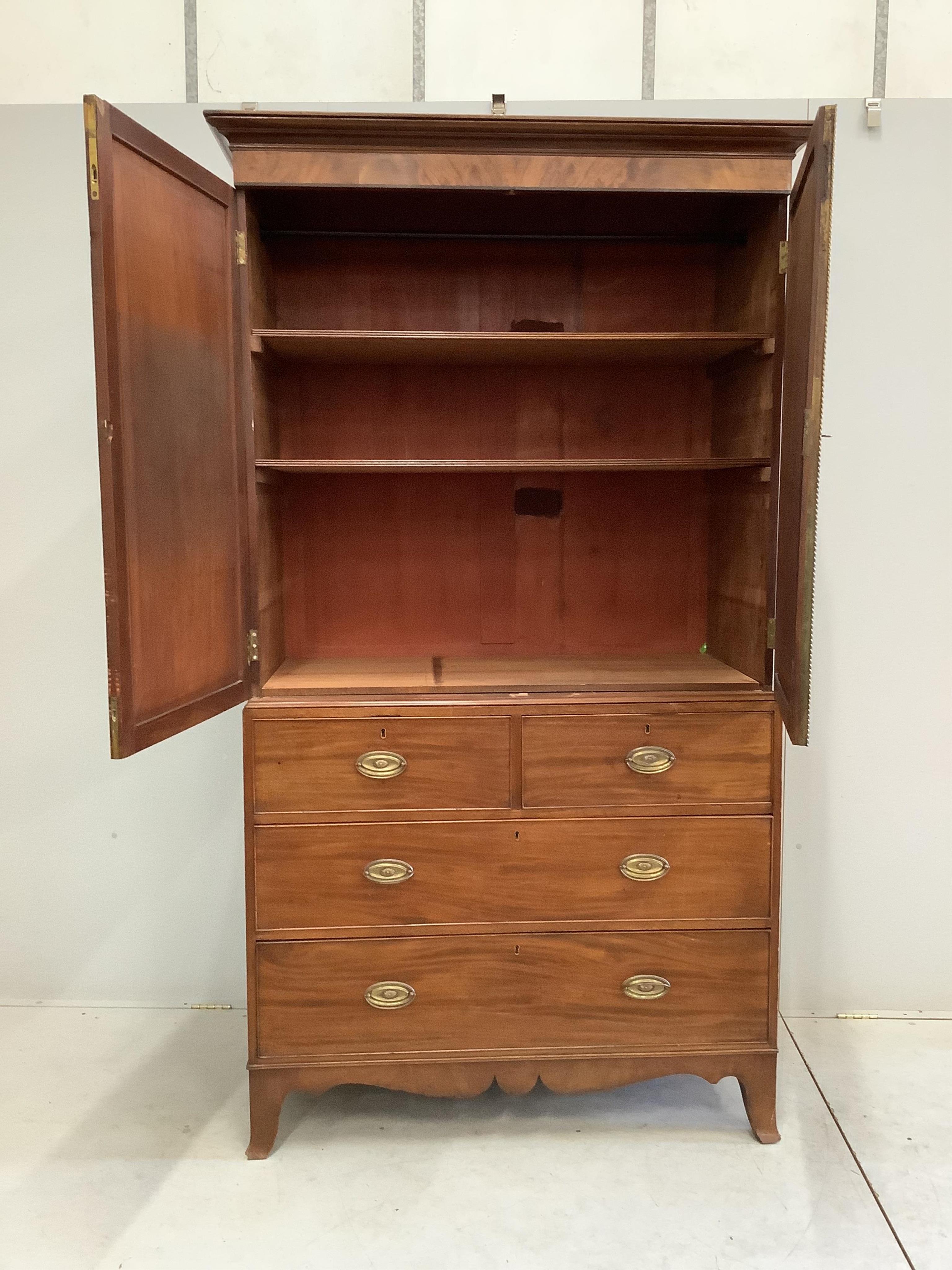 A Regency mahogany linen press, width 120cm, depth 56cm, height 211cm. Condition - fair, interior shelves are later